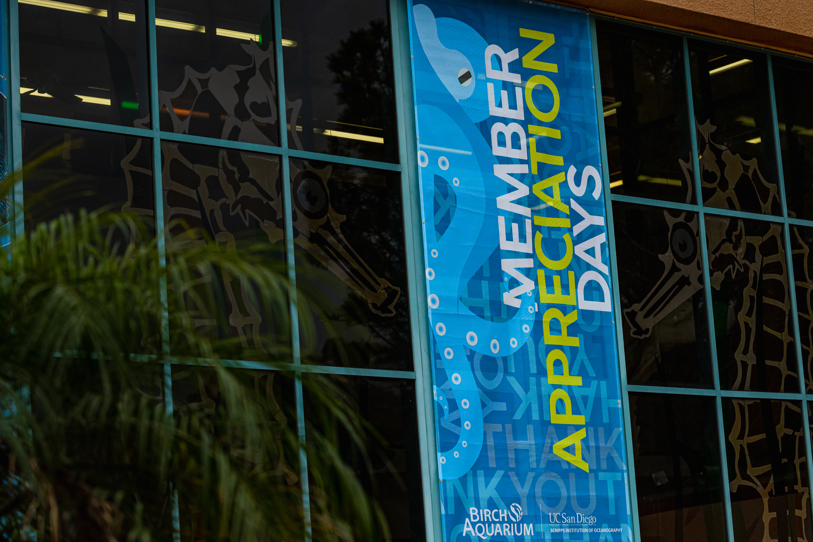 A banner that hands on the aquarium's entrance that says Member Appreciation Days.