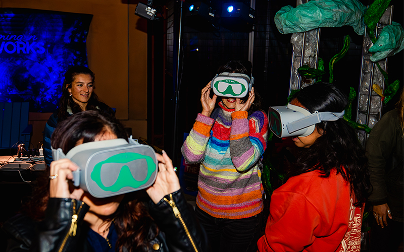 Guests use virtual reality (VR) headsets to explore Scripps Oceanography research reefs in Hawaii and other tropical locations.