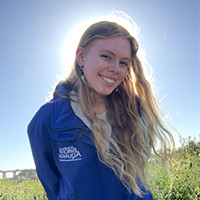 A picture of Jazz, a student in the aquarium's Guest Services department.