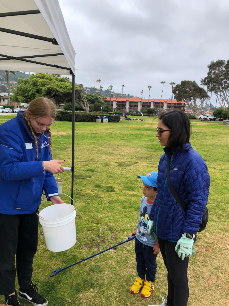 Aquarium staff weighs some of the trash collected by volunteers during the cleanup.